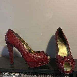 Stuart Weitzman red snakeskin peep toe pumps